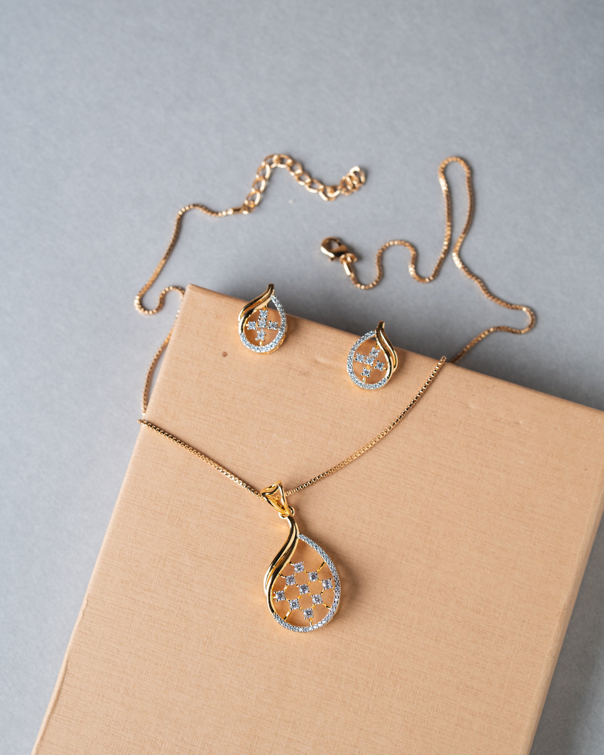 Gold-Toned American Diamond (AD) Floral Teardrop Pendant Set