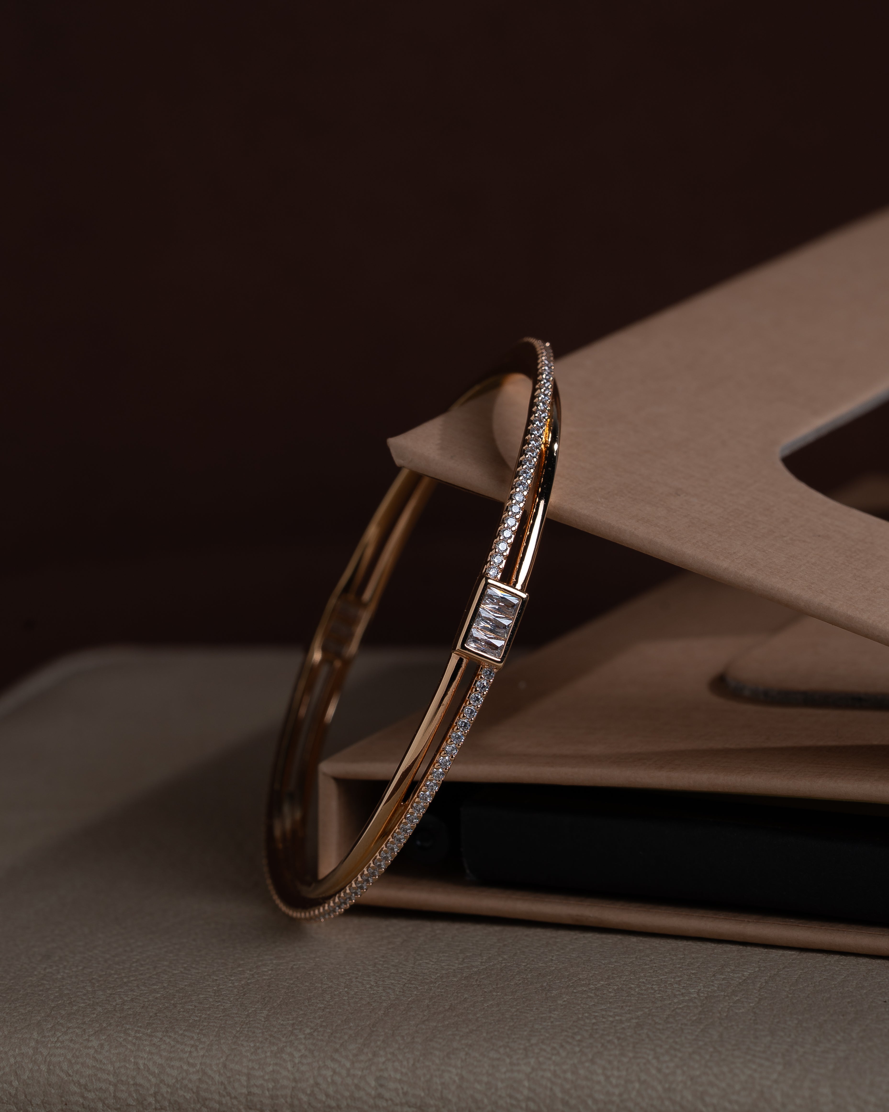 delicate rose gold toned zircon bangle